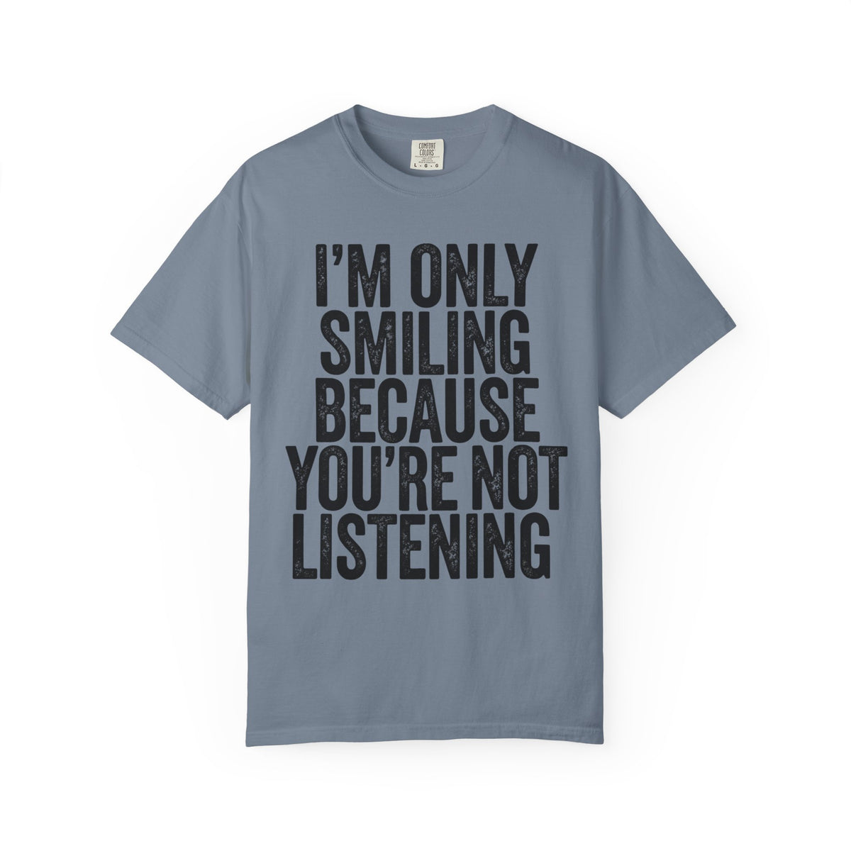 Color: Blue Jean | I'm Only Smiling Because You're Not Listening Unisex Garment-Dyed Tee